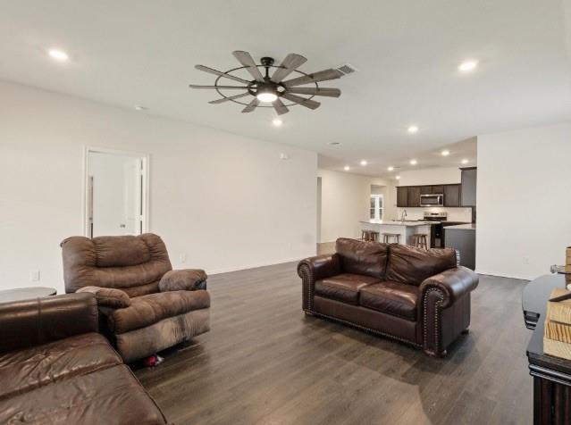 1223 Trevino Road Forney, TX 75126 - Photo 5 of 20 a living room with furniture and a chandelier