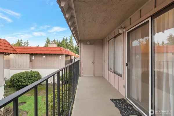 a view of balcony with wooden floor