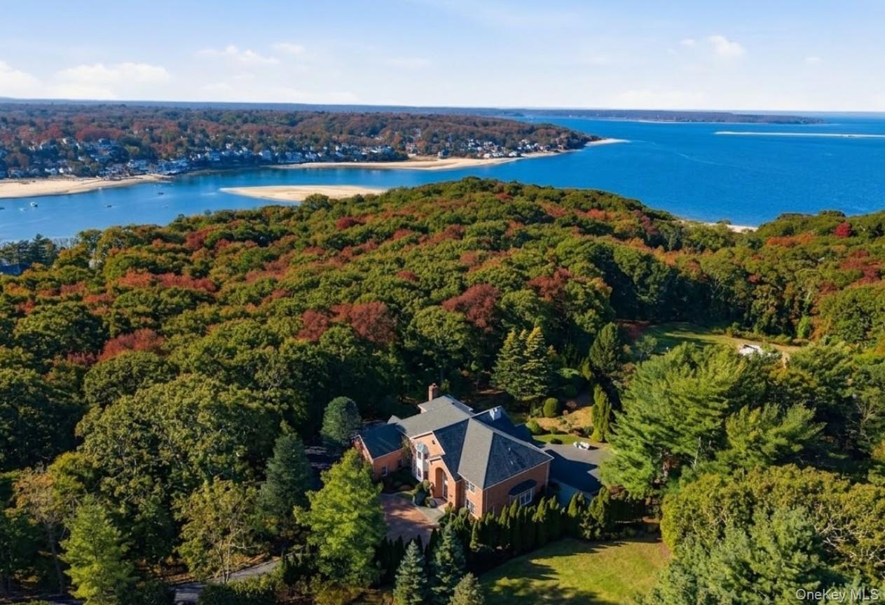 19 Cobblestone Court Centerport, NY 11721 - Photo 2 of 45 an aerial view of a house with a lake view