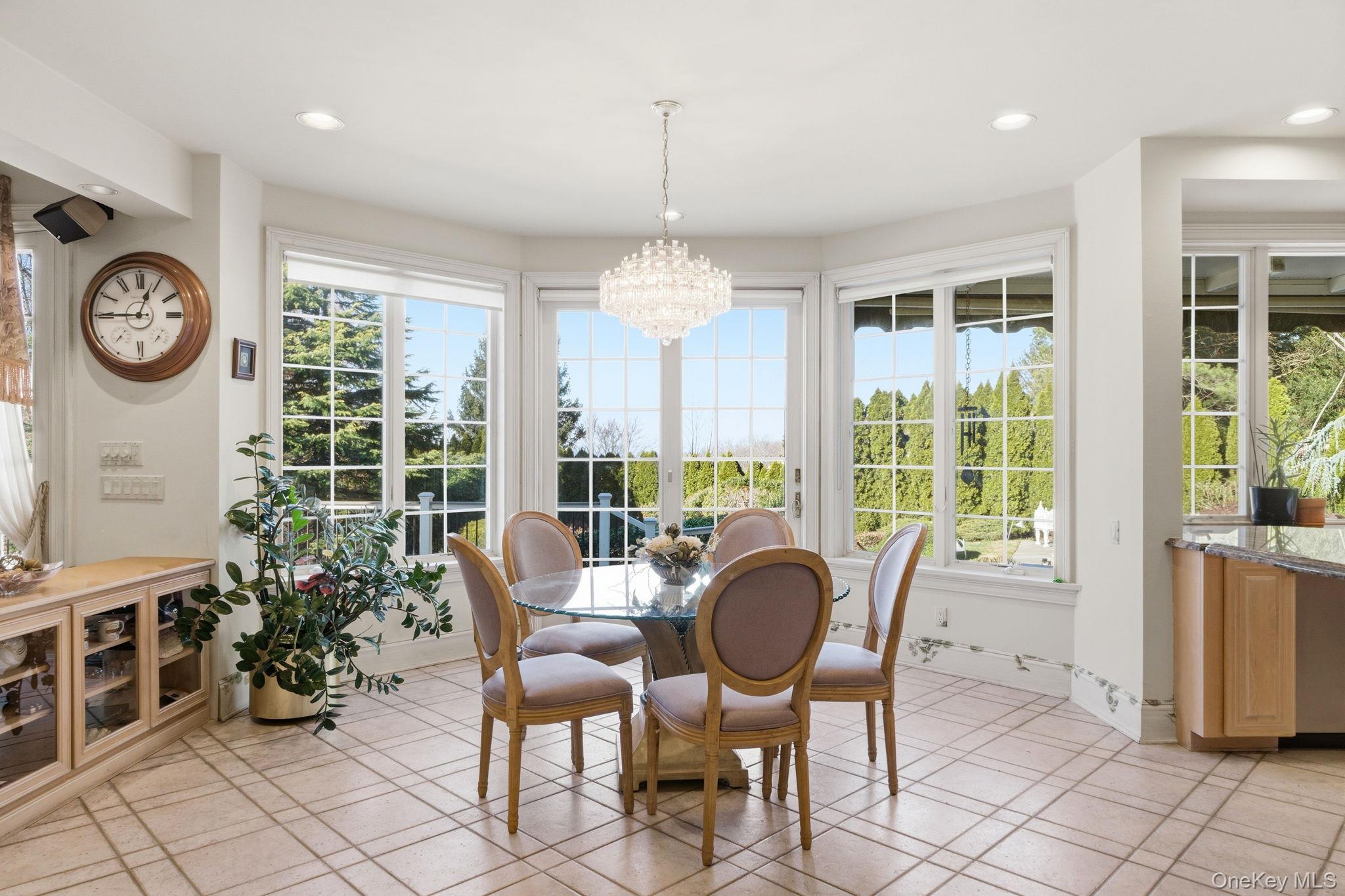 19 Cobblestone Court Centerport, NY 11721 - Photo 21 of 45 a view of a dining room with furniture window and outside view