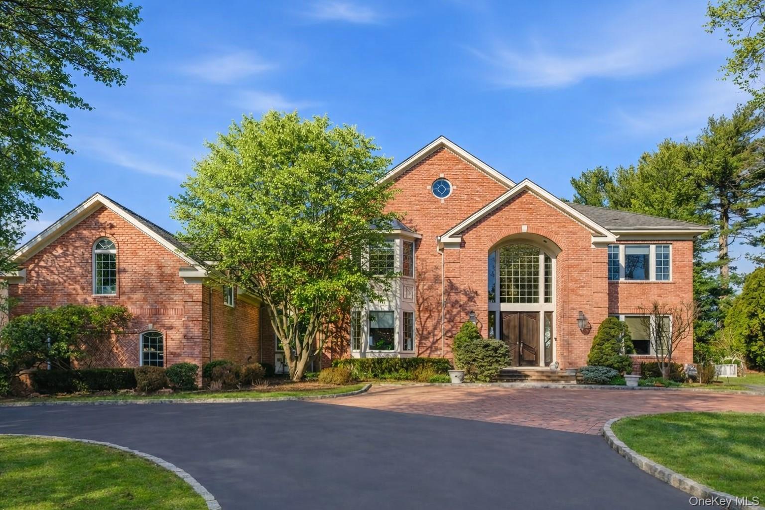 19 Cobblestone Court Centerport, NY 11721 - Photo 3 of 45 a front view of a house with a yard
