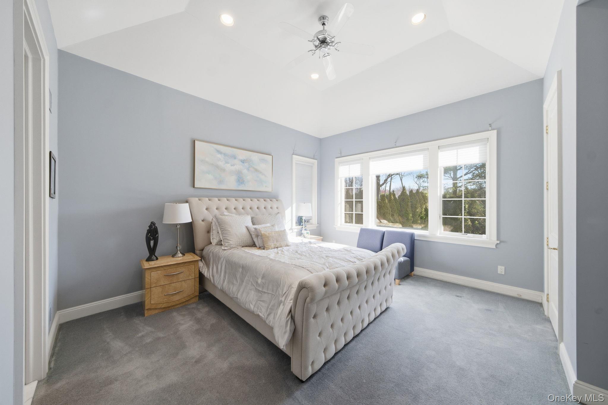19 Cobblestone Court Centerport, NY 11721 - Photo 33 of 45 a bedroom with a bed and window