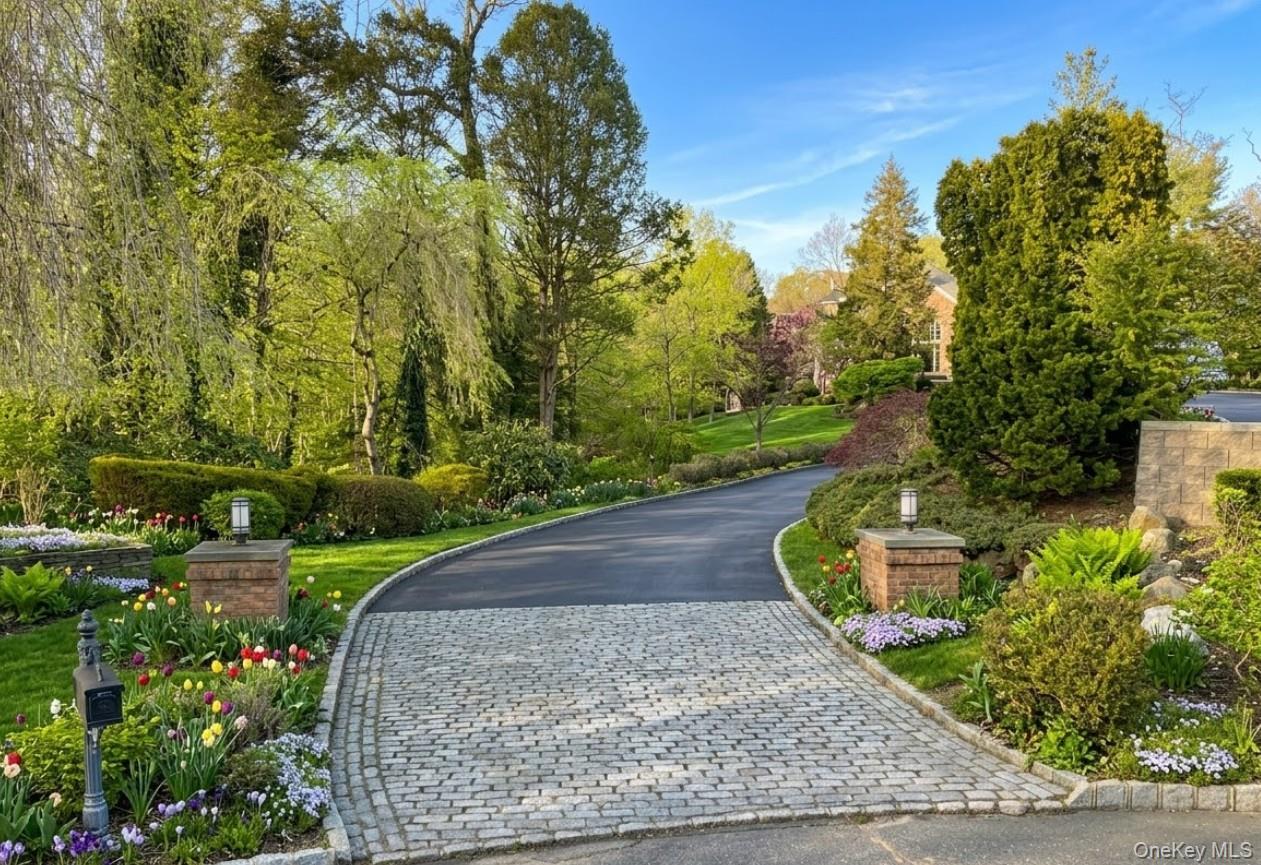 19 Cobblestone Court Centerport, NY 11721 - Photo 4 of 45 a view of a garden with large trees
