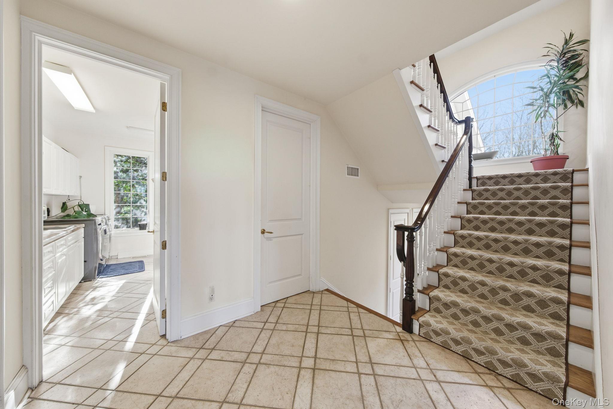 19 Cobblestone Court Centerport, NY 11721 - Photo 45 of 45 a view of an entryway with staircase