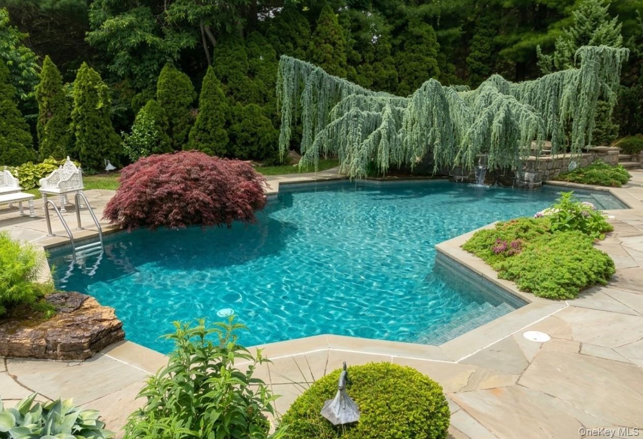 19 Cobblestone Court Centerport, NY 11721 - Photo 6 of 45 a view of a garden with large trees
