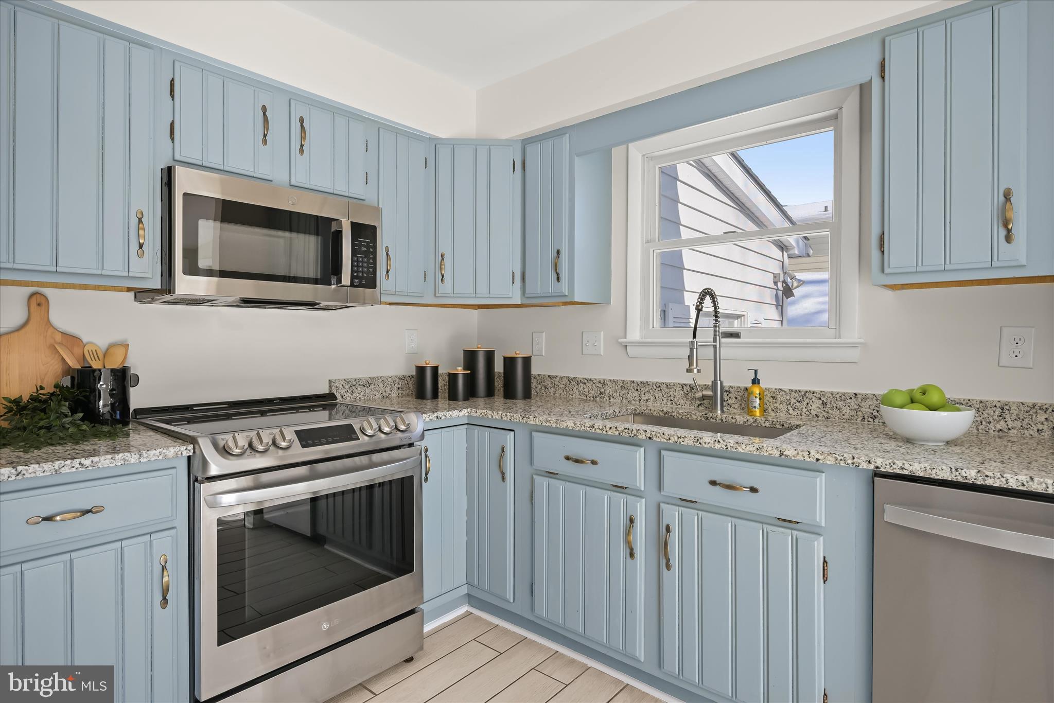 1443 Rehling Drive Edgewater, MD 21037 - Photo 11 of 54 a kitchen with granite countertop stainless steel appliances white cabinets granite counter tops and a window
