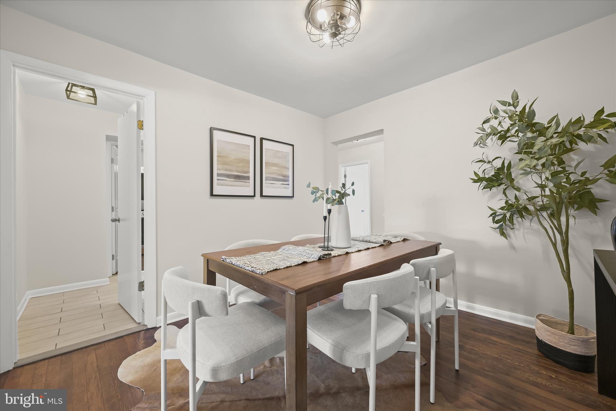 1443 Rehling Drive Edgewater, MD 21037 - Photo 13 of 54 a view of a dining room with furniture and wooden floor