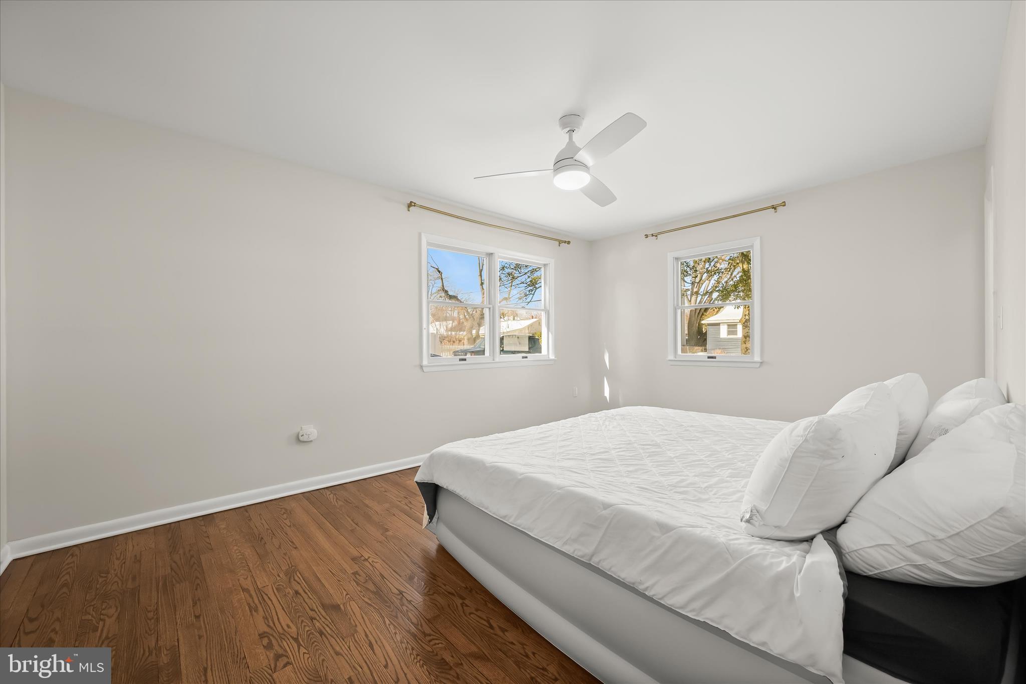 1443 Rehling Drive Edgewater, MD 21037 - Photo 15 of 54 a bedroom with a bed and wooden floor