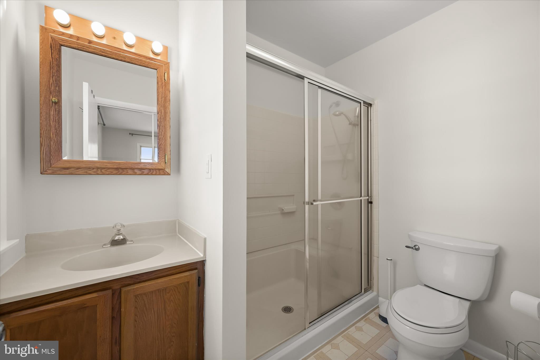 1443 Rehling Drive Edgewater, MD 21037 - Photo 17 of 54 a bathroom with a toilet a sink and shower