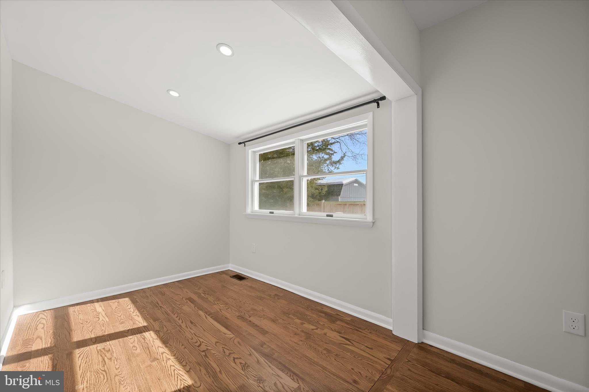 1443 Rehling Drive Edgewater, MD 21037 - Photo 18 of 54 a view of empty room with wooden floor and fan