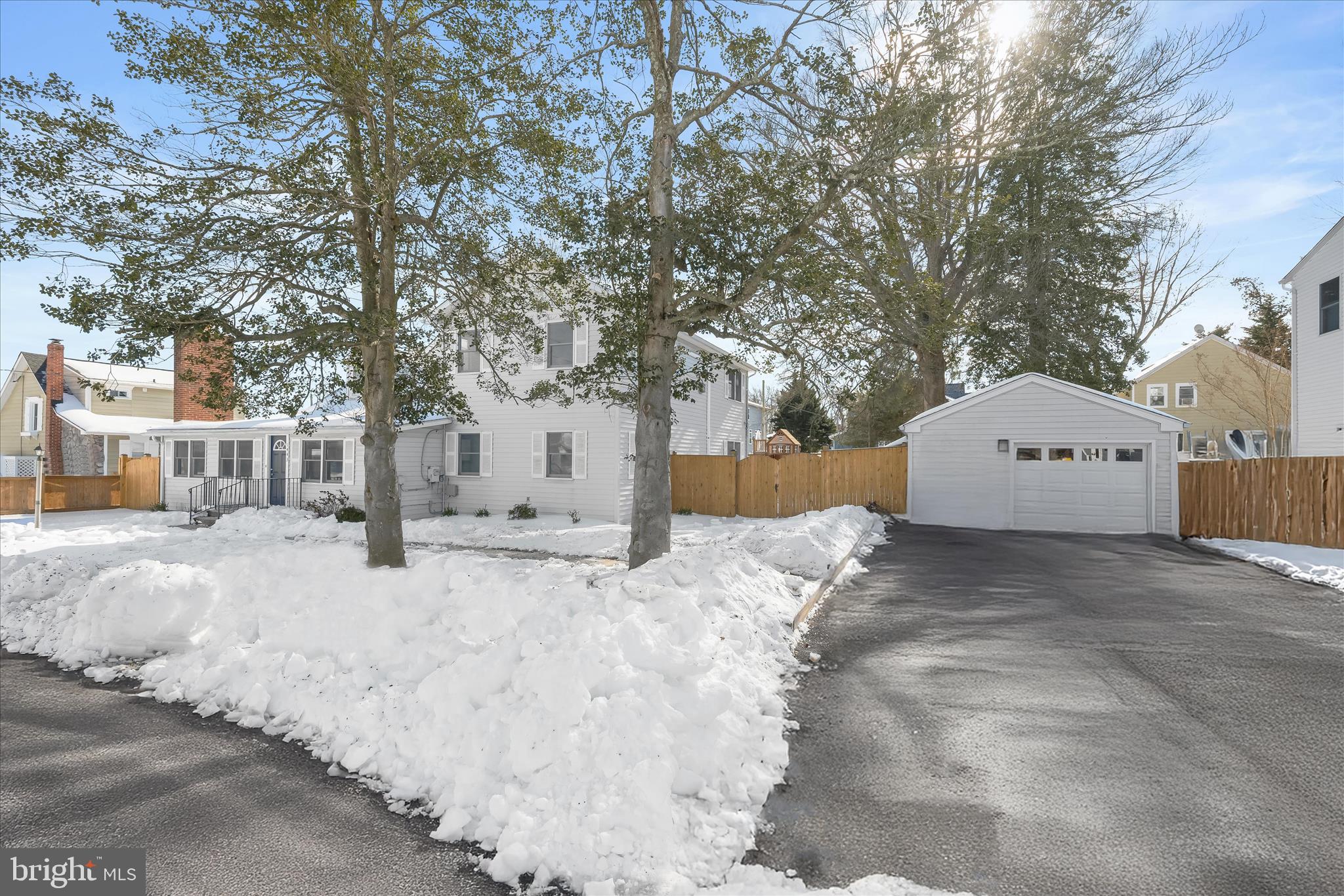 1443 Rehling Drive Edgewater, MD 21037 - Photo 2 of 54 a view of a white house with a snow in the yard