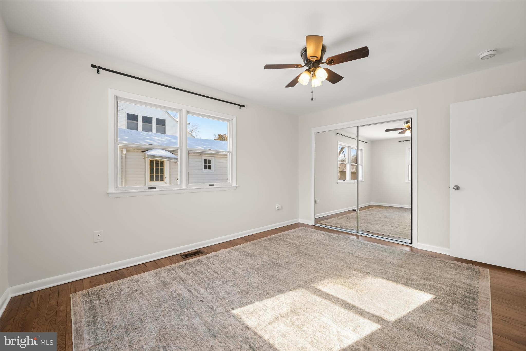 1443 Rehling Drive Edgewater, MD 21037 - Photo 21 of 54 a view of a livingroom with a ceiling fan and wooden floor