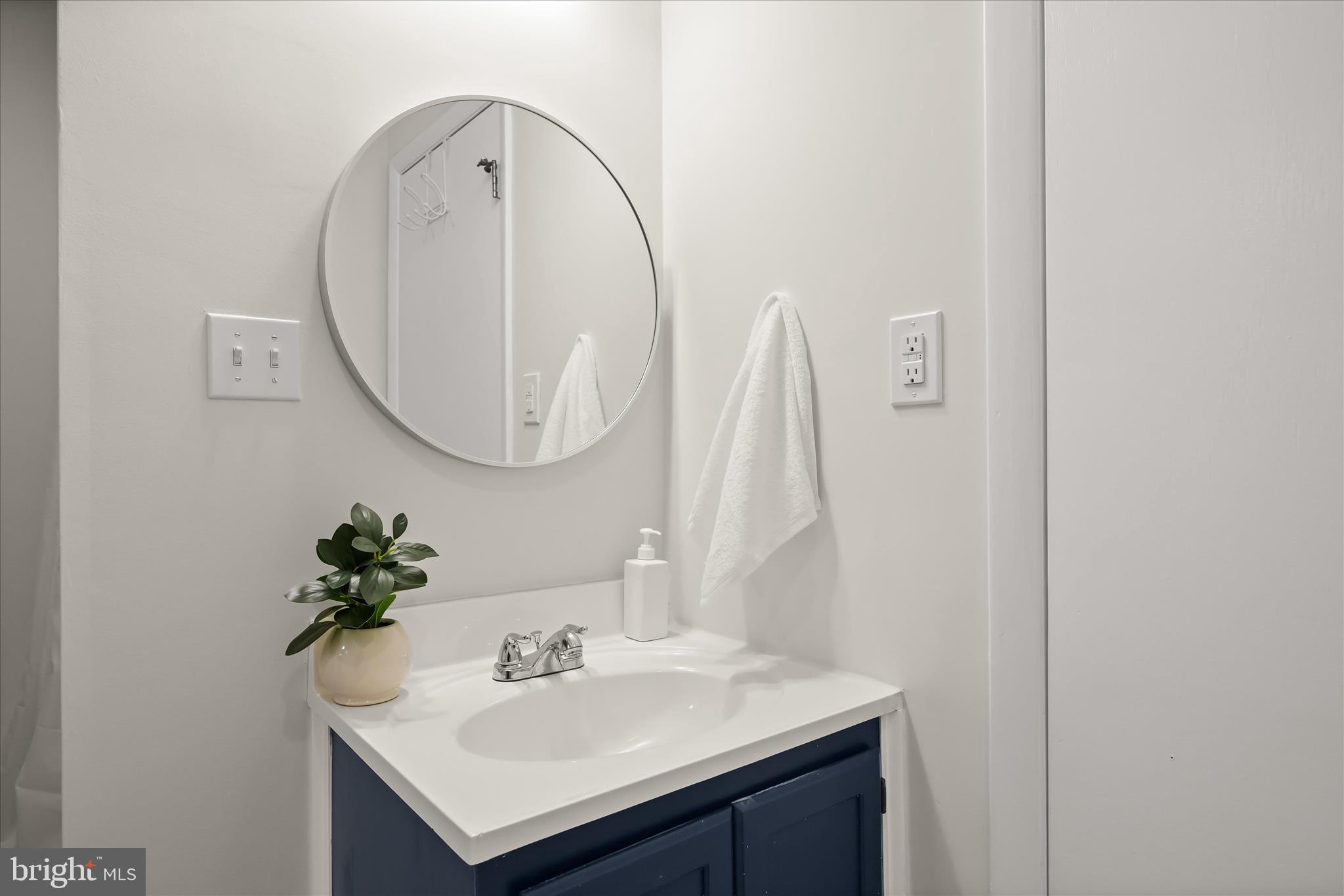 1443 Rehling Drive Edgewater, MD 21037 - Photo 24 of 54 a bathroom with a sink and a mirror