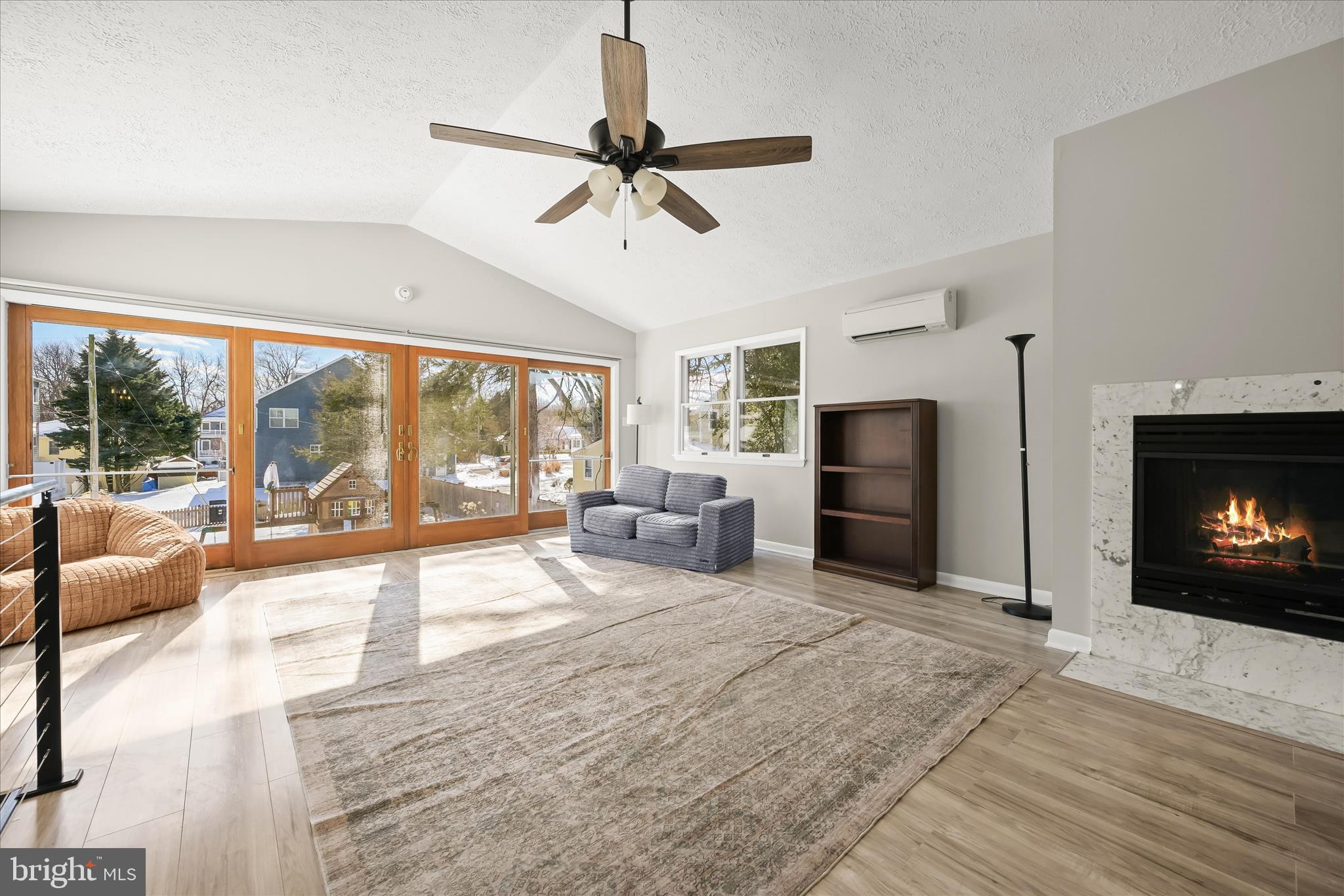 1443 Rehling Drive Edgewater, MD 21037 - Photo 26 of 54 a living room with furniture a fireplace and a flat screen tv