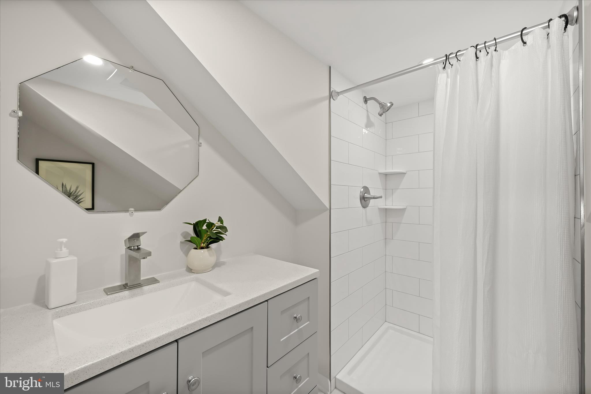 1443 Rehling Drive Edgewater, MD 21037 - Photo 32 of 54 a bathroom with a sink a mirror a vanity and shower