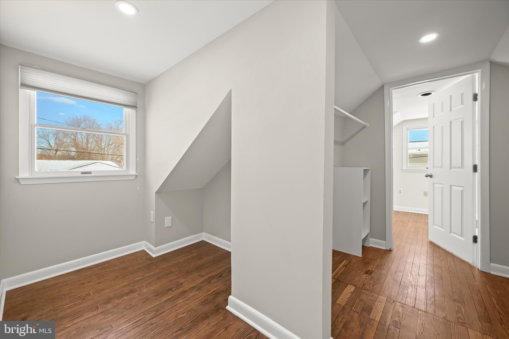 1443 Rehling Drive Edgewater, MD 21037 - Photo 33 of 54 an empty room with wooden floor and a window