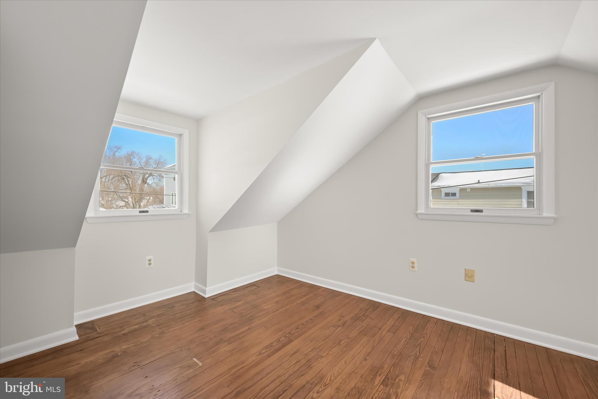 1443 Rehling Drive Edgewater, MD 21037 - Photo 35 of 54 an empty room with wooden floor and hallway