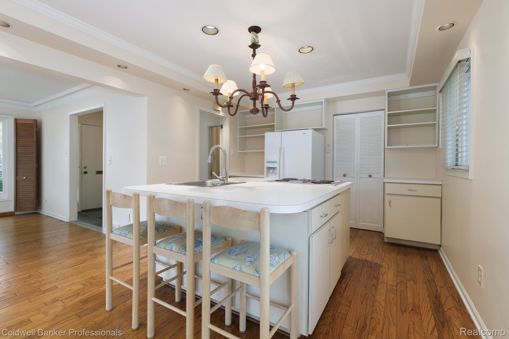 1018 Harvard Road Grosse Pointe, MI 48230 - Photo 15 of 40 Kitchen featuring a center island with integrated sink, recessed lighting, and wood-finish flooring