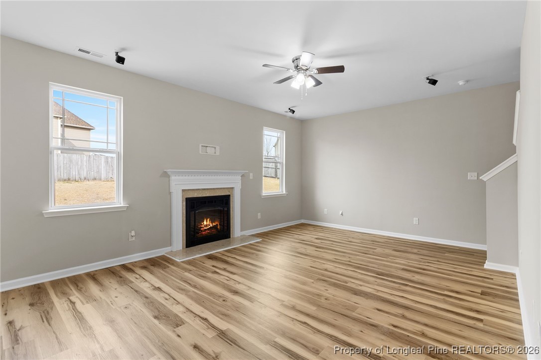 288 New Castle Lane Spring Lake, NC 28390 - Photo 11 of 39 a view of an empty room with window and fire place