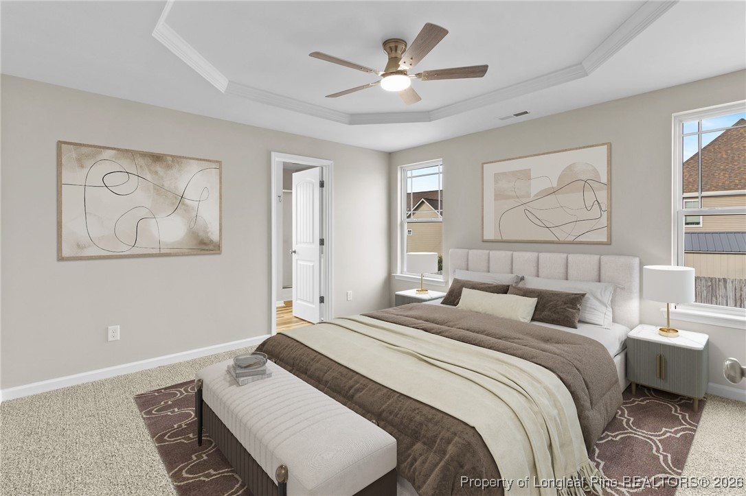 288 New Castle Lane Spring Lake, NC 28390 - Photo 20 of 39 a bedroom with a large bed and a painting on the wall