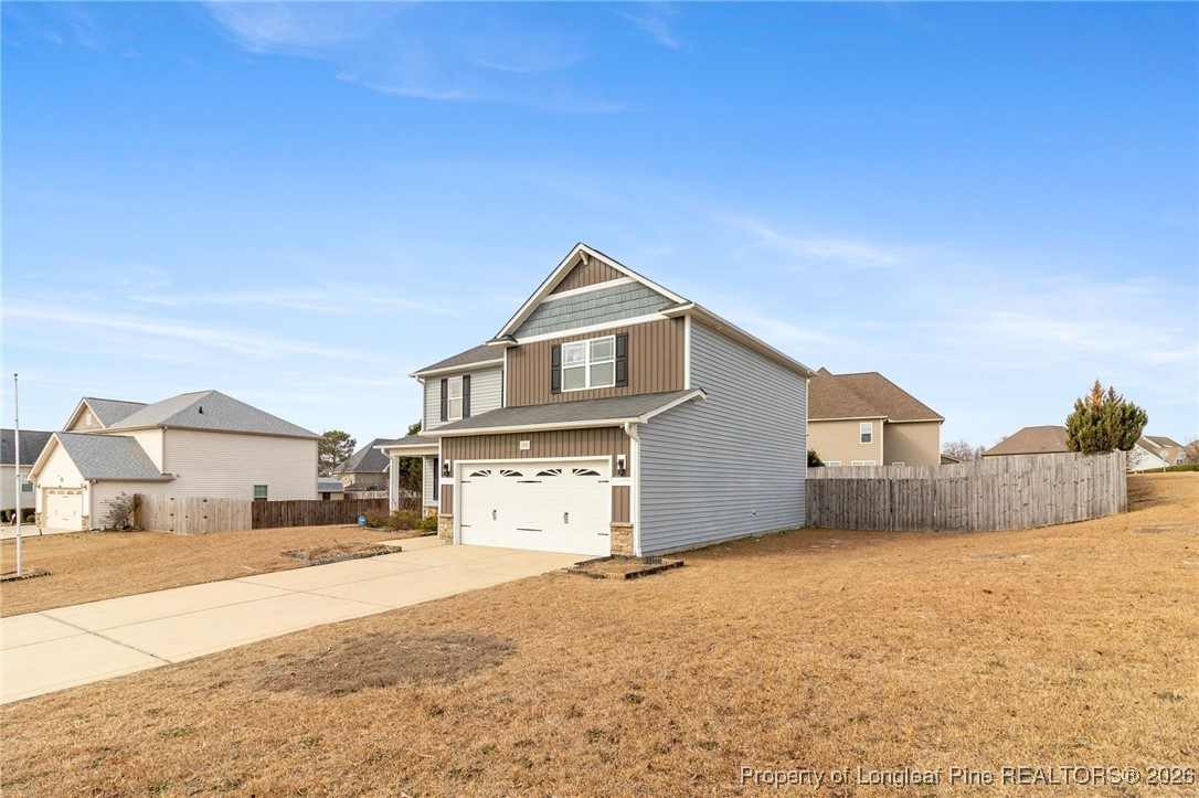 288 New Castle Lane Spring Lake, NC 28390 - Photo 2 of 39 a front view of a house with a yard