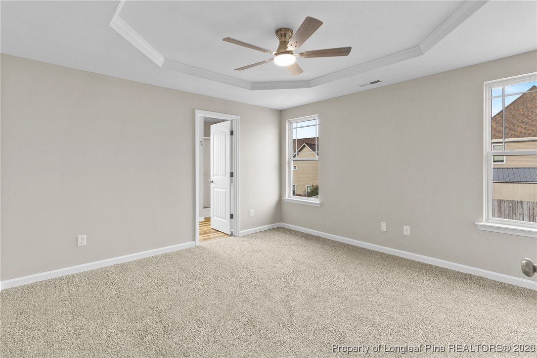 288 New Castle Lane Spring Lake, NC 28390 - Photo 21 of 39 an empty room with windows and fan