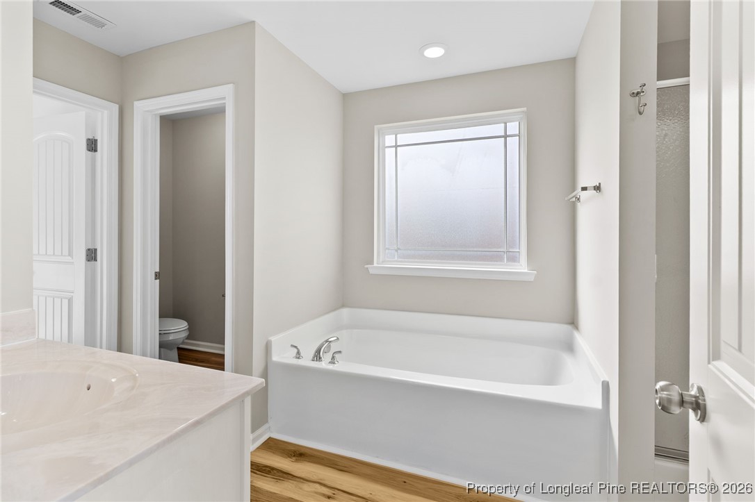 288 New Castle Lane Spring Lake, NC 28390 - Photo 23 of 39 a white bath tub sitting next to a white sink