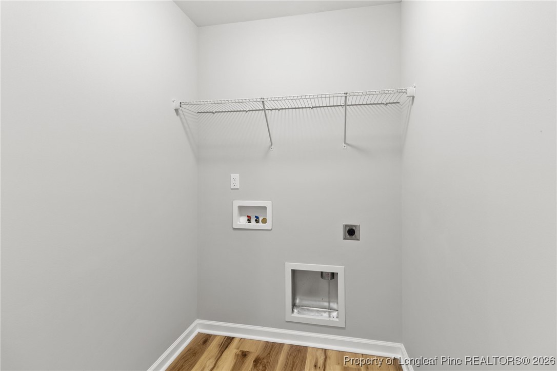 288 New Castle Lane Spring Lake, NC 28390 - Photo 28 of 39 a view of a small space with racks on the wall