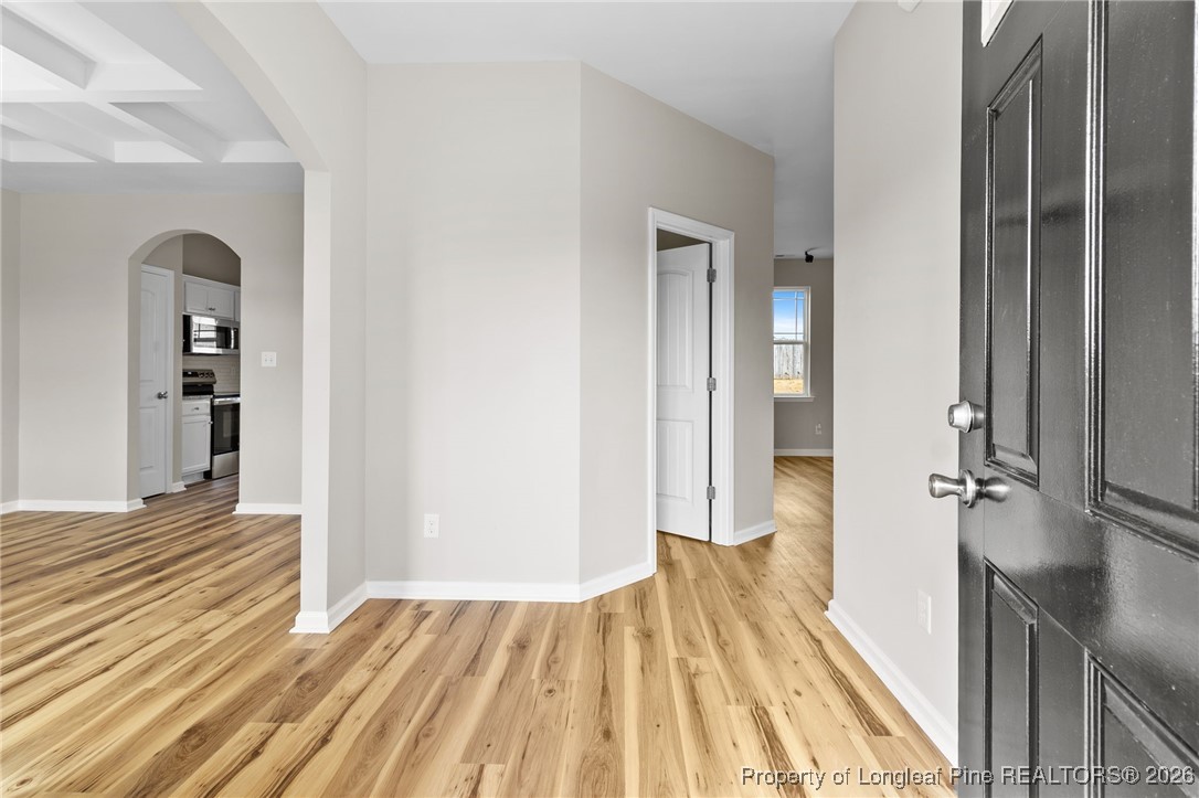 288 New Castle Lane Spring Lake, NC 28390 - Photo 5 of 39 a view of a room with wooden floor and staircase