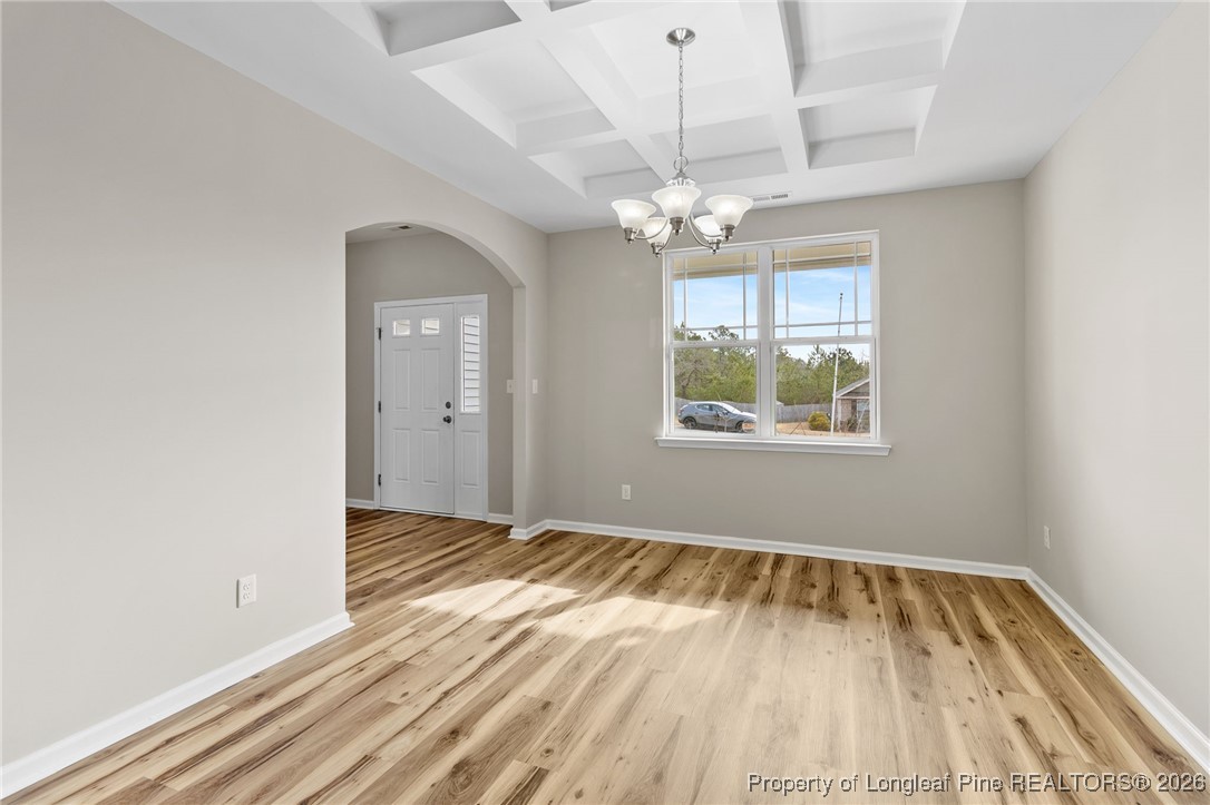 288 New Castle Lane Spring Lake, NC 28390 - Photo 8 of 39 wooden floor in an empty room with a window