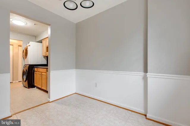 a view of storage and utility room with closet