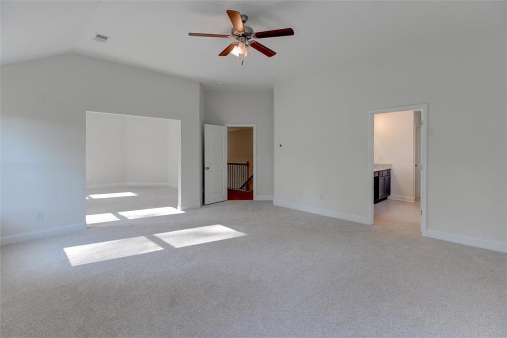 41 Woodland Road Covington, GA 30016 - Photo 36 of 46 a view of a livingroom with a ceiling fan and window