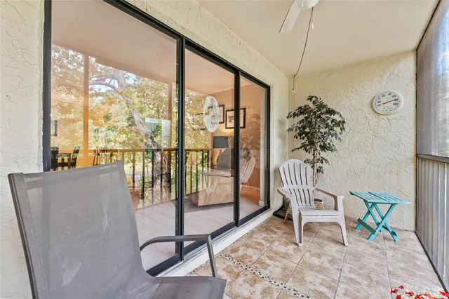 a view of a chairs and table in patio