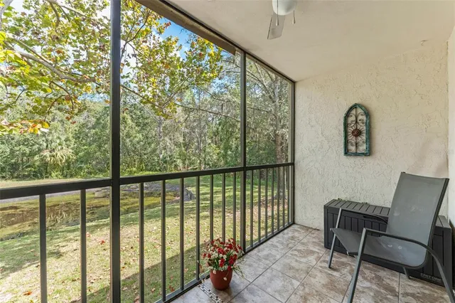 a view of a room with furniture and windows