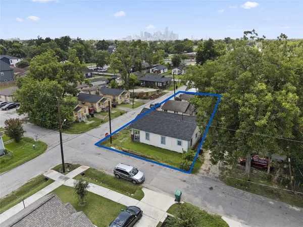 an aerial view of a house with a garden