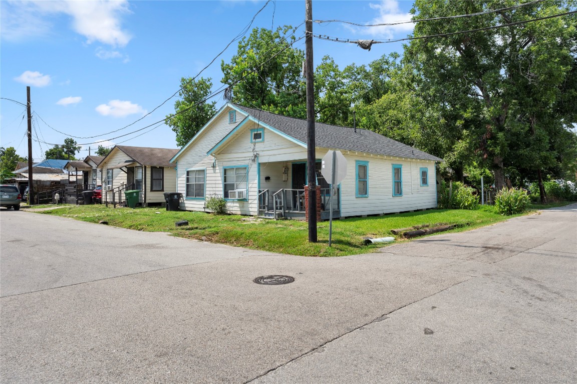 5611 Nichols Street Houston, TX 77020 - Photo 2 of 6 a view of a house next to a yard with big trees