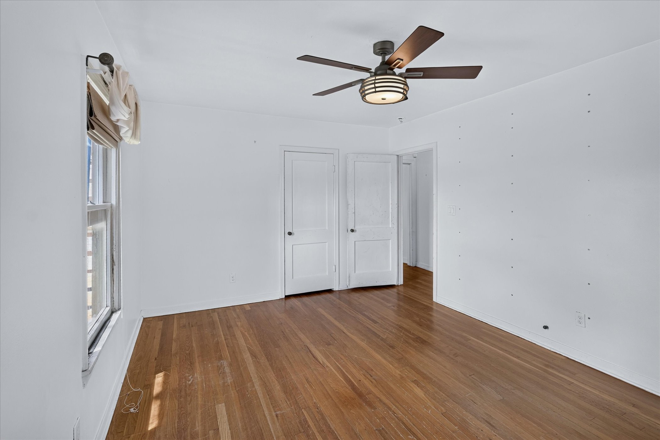 5701 Link Avenue Austin, TX 78752 - Photo 3 of 7 a view of room with a ceiling fan and wooden floor