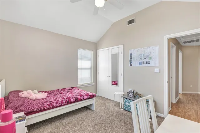 a bedroom with furniture and a window