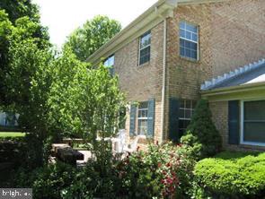 9668 Hagel Circle, Unit 34/B Lorton, VA 22079 - Photo 1 of 19 front view of a house with a tree