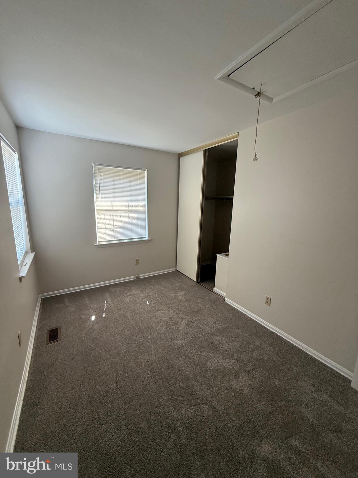 9668 Hagel Circle, Unit 34/B Lorton, VA 22079 - Photo 18 of 19 an empty room with windows and closet