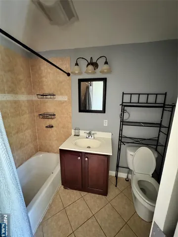 a bathroom with a sink a bathtub and a shower