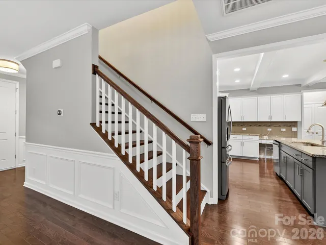a view of kitchen with sink microwave and stove