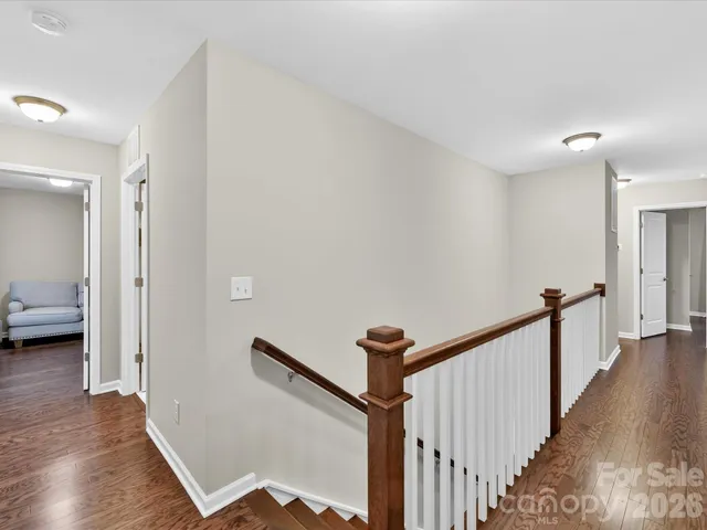a view of a hallway to a livingroom and a hallway