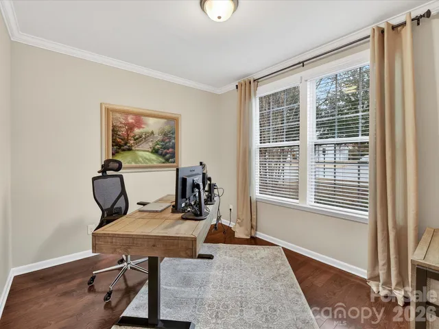a workspace with furniture and a window