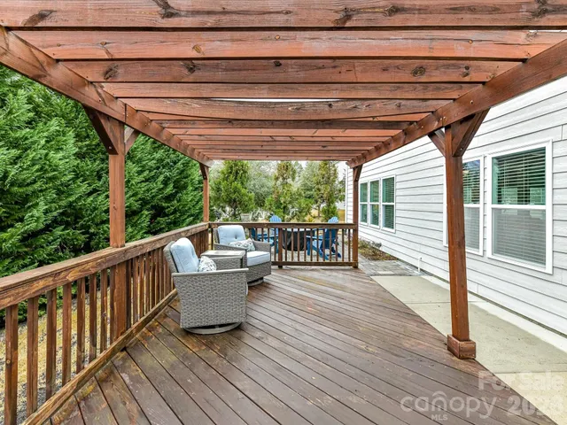 a balcony with furniture and wooden floor