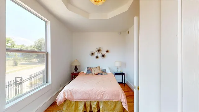 a bedroom with a bed and window