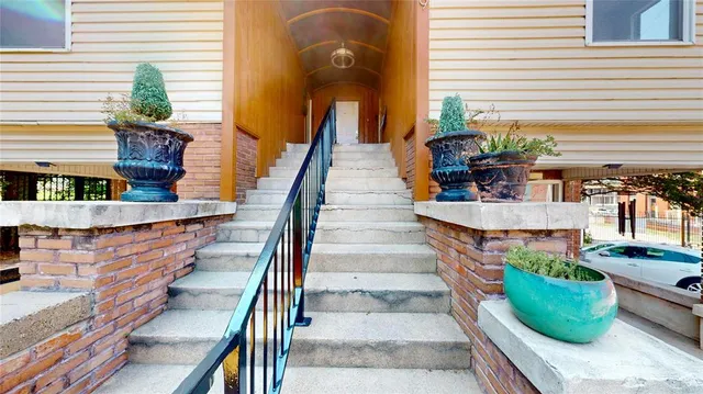 a view of a house with balcony and outdoor space