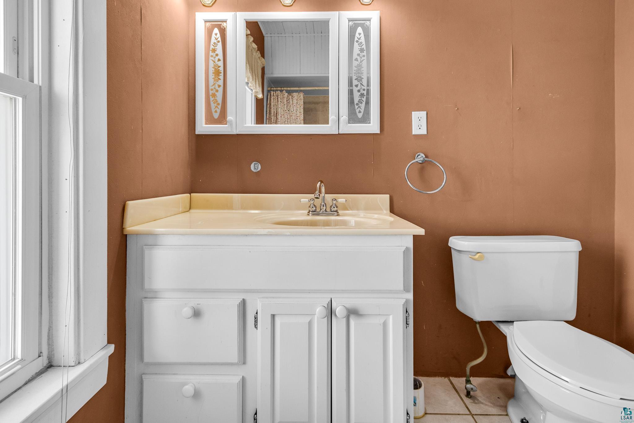 6494 School Street Finlayson, MN 55735 - Photo 26 of 31 Bathroom with vanity, curtained shower, and tile patterned floors