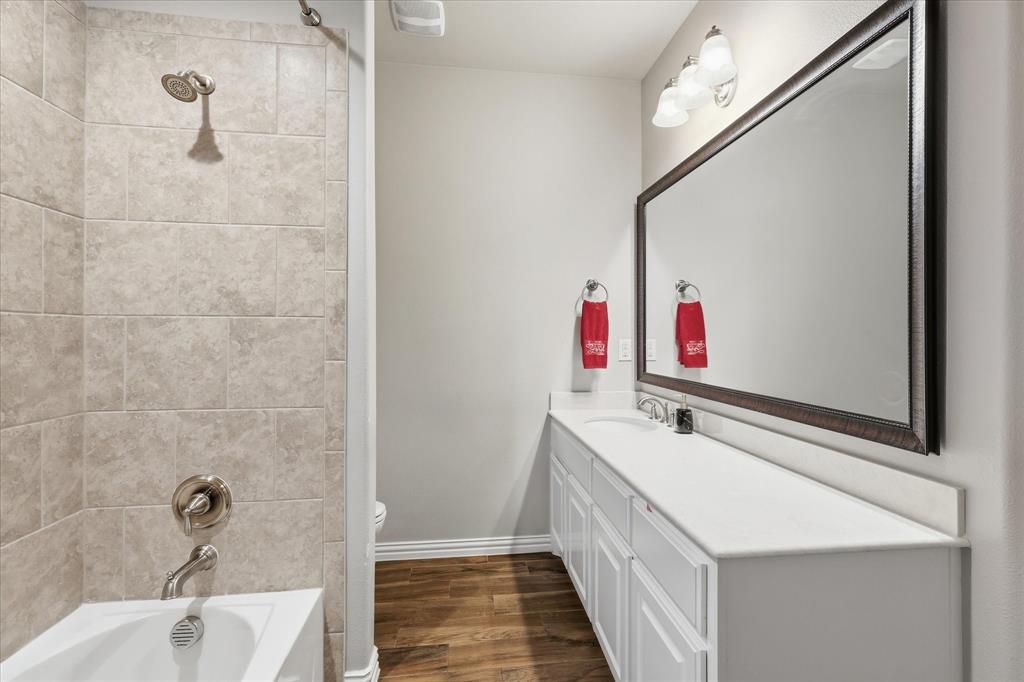 215 Equestrian Road Hickory Creek, TX 75065 - Photo 21 of 36 a bathroom with a tub sink and mirror