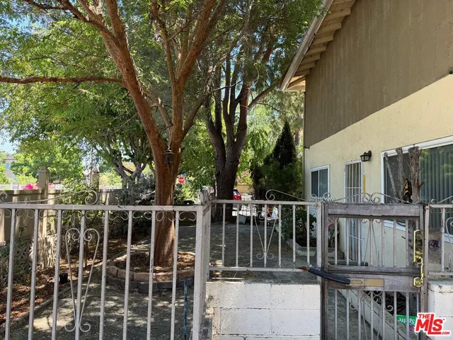a view of a deck with wooden floor and fence